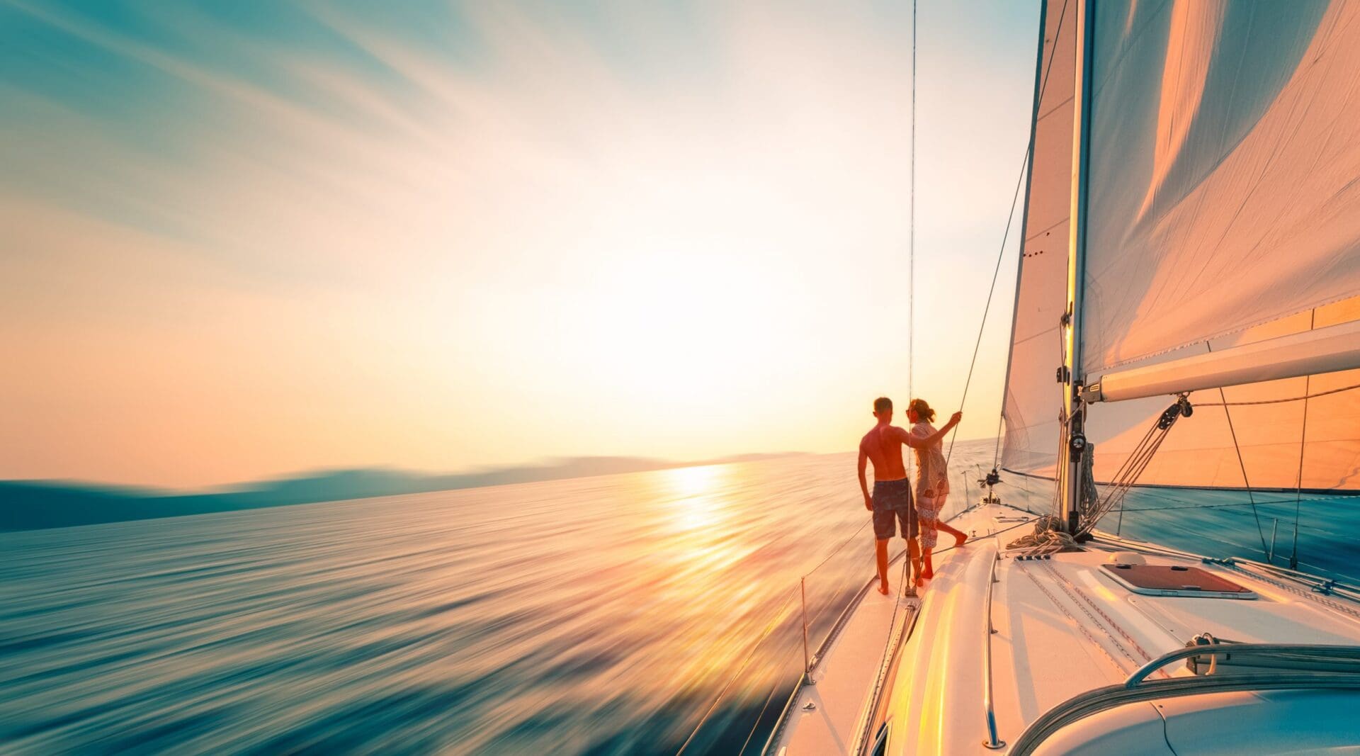 A couple of people standing on top of a boat.