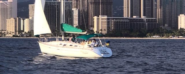 A boat with people on it in the water.