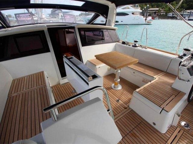 A boat with wooden floors and white walls.