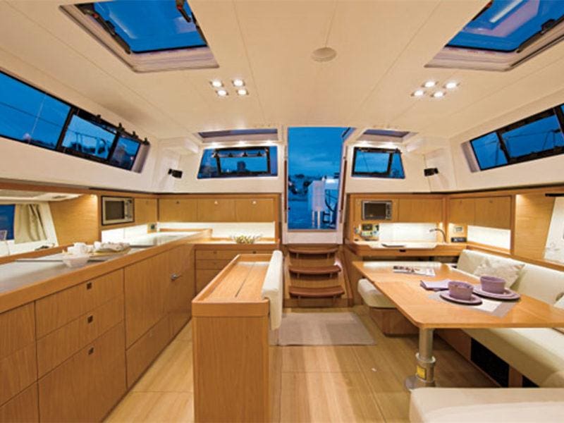 A large kitchen with lots of counter space and windows.