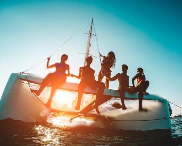 A group of people on a boat in the ocean.